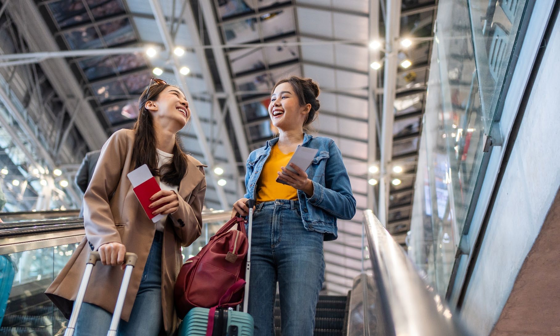 Travellers walking through an airport terminal